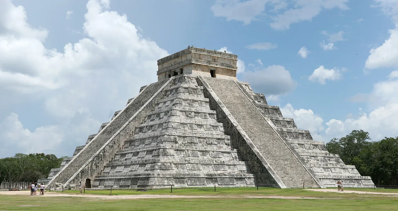 El Castillo, the Temple of Kukulcan at Chichen Itza, a stepped pyramid under a blue sky