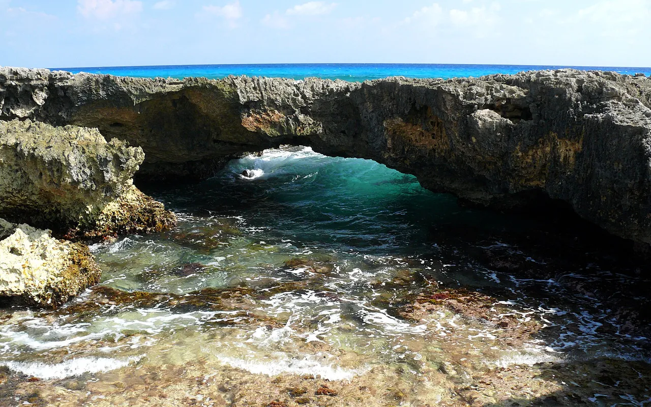 Natural rock arch by the sea on the windward east coast of Cozumel