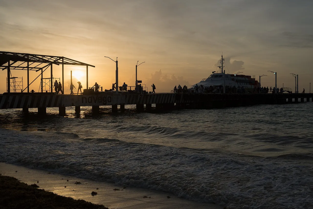Cozumel ferry docked at the Playa del Carmen pier at sunrise