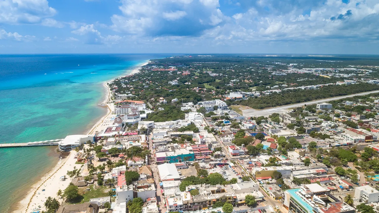 Aerial view of the Playa del Carmen coastline with the town, the beach and the ferry pier