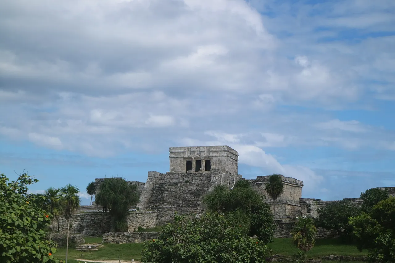 El Castillo at Tulum seen from the landward side, above a grassy plaza