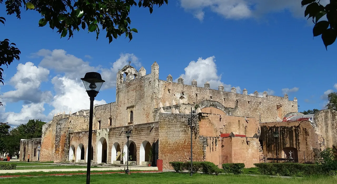 Facade of the former convent of San Bernardino de Siena in Valladolid, Yucatan, under a blue sky